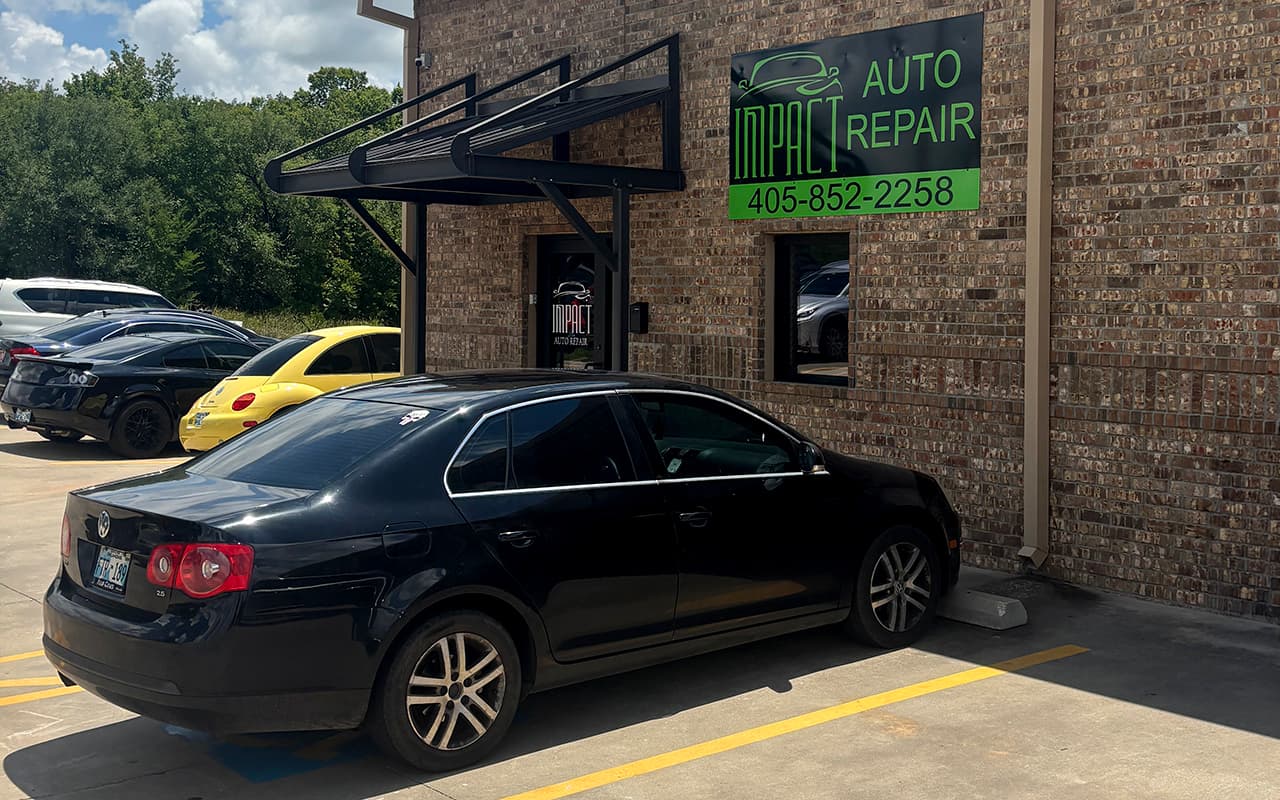 Vehicle parked outside Impact Auto Repair for inspection