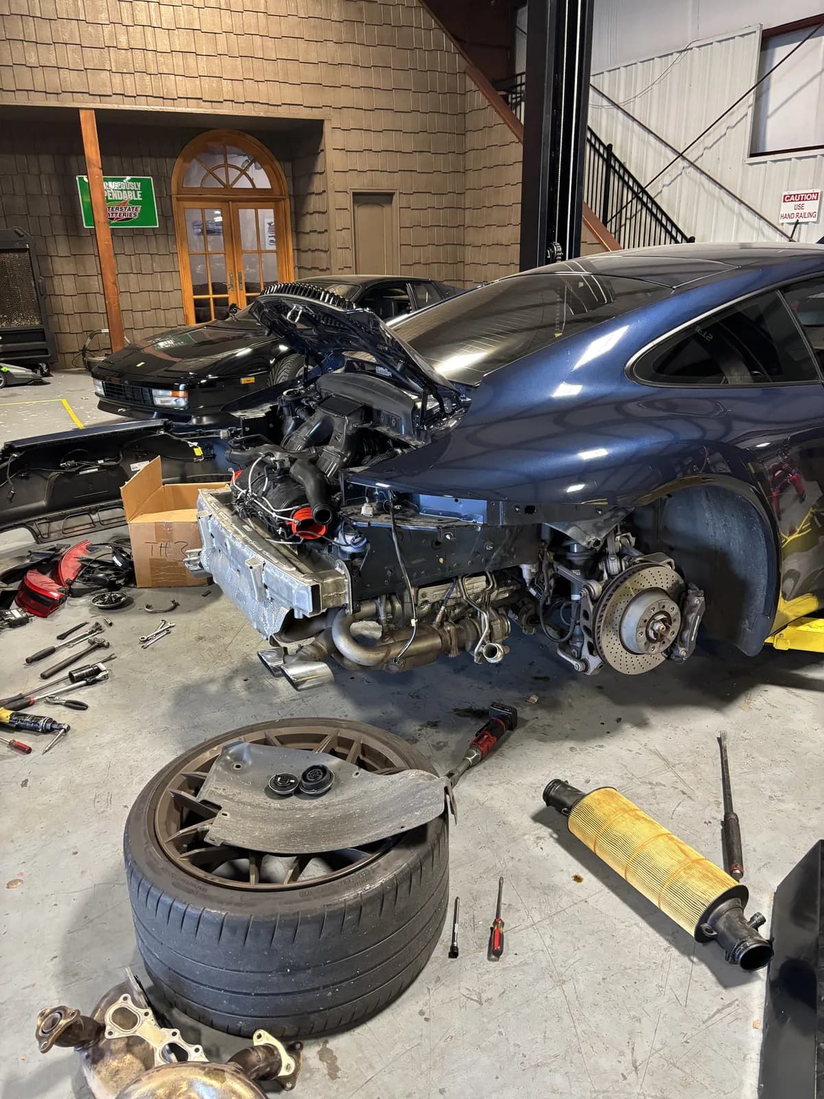 Wheel removed for brake service at Impact Auto Repair