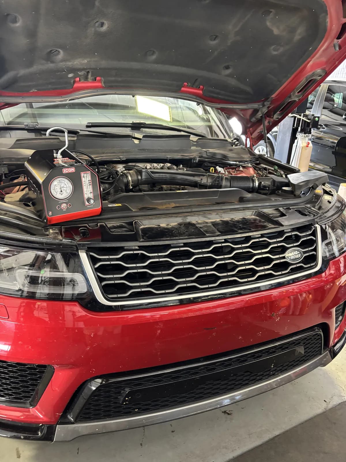 Range Rover with the hood open during electrical diagnosis at Impact Auto Repair