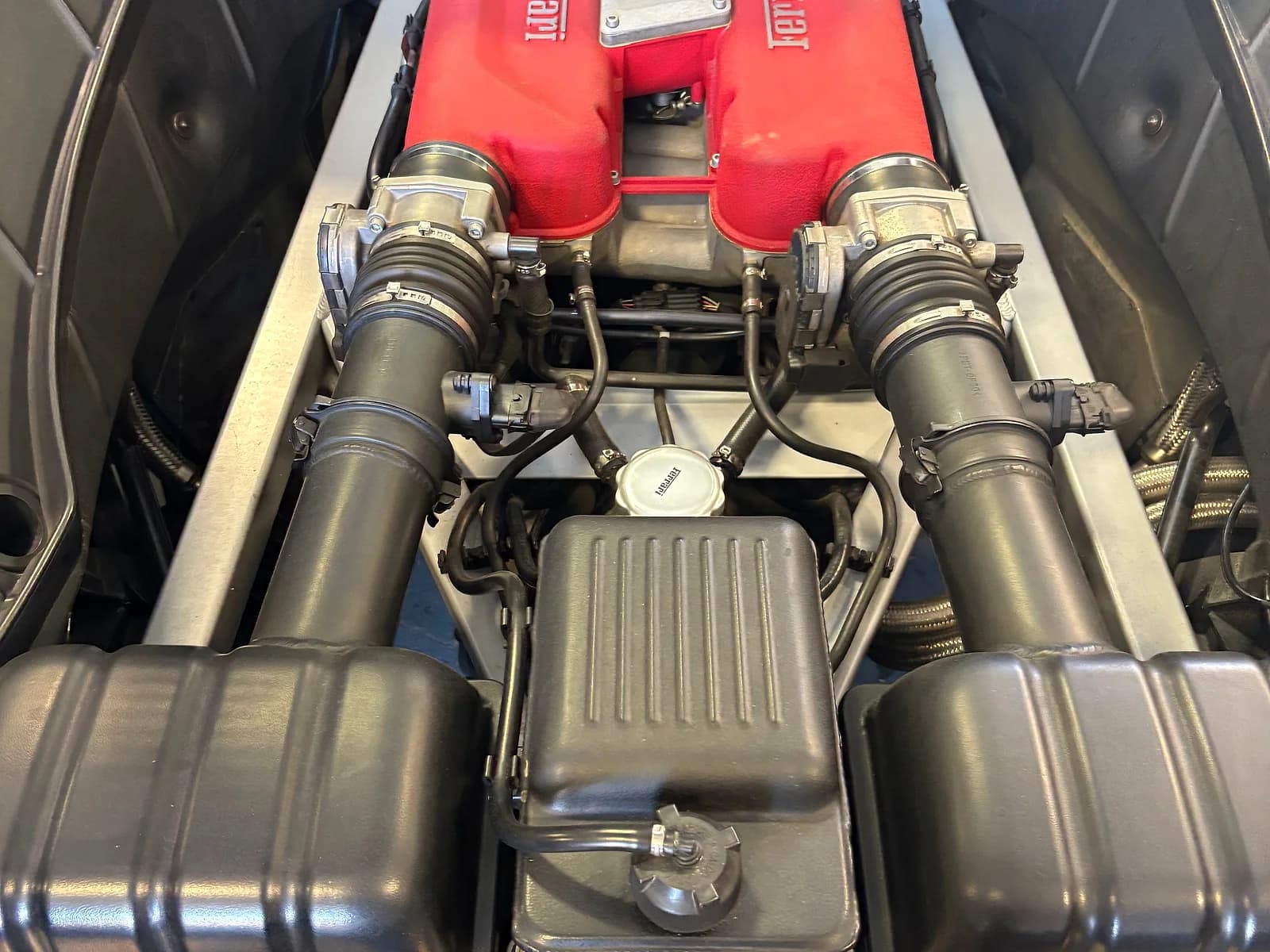 Ferrari Testarossa engine bay during diagnostics at Impact Auto Repair