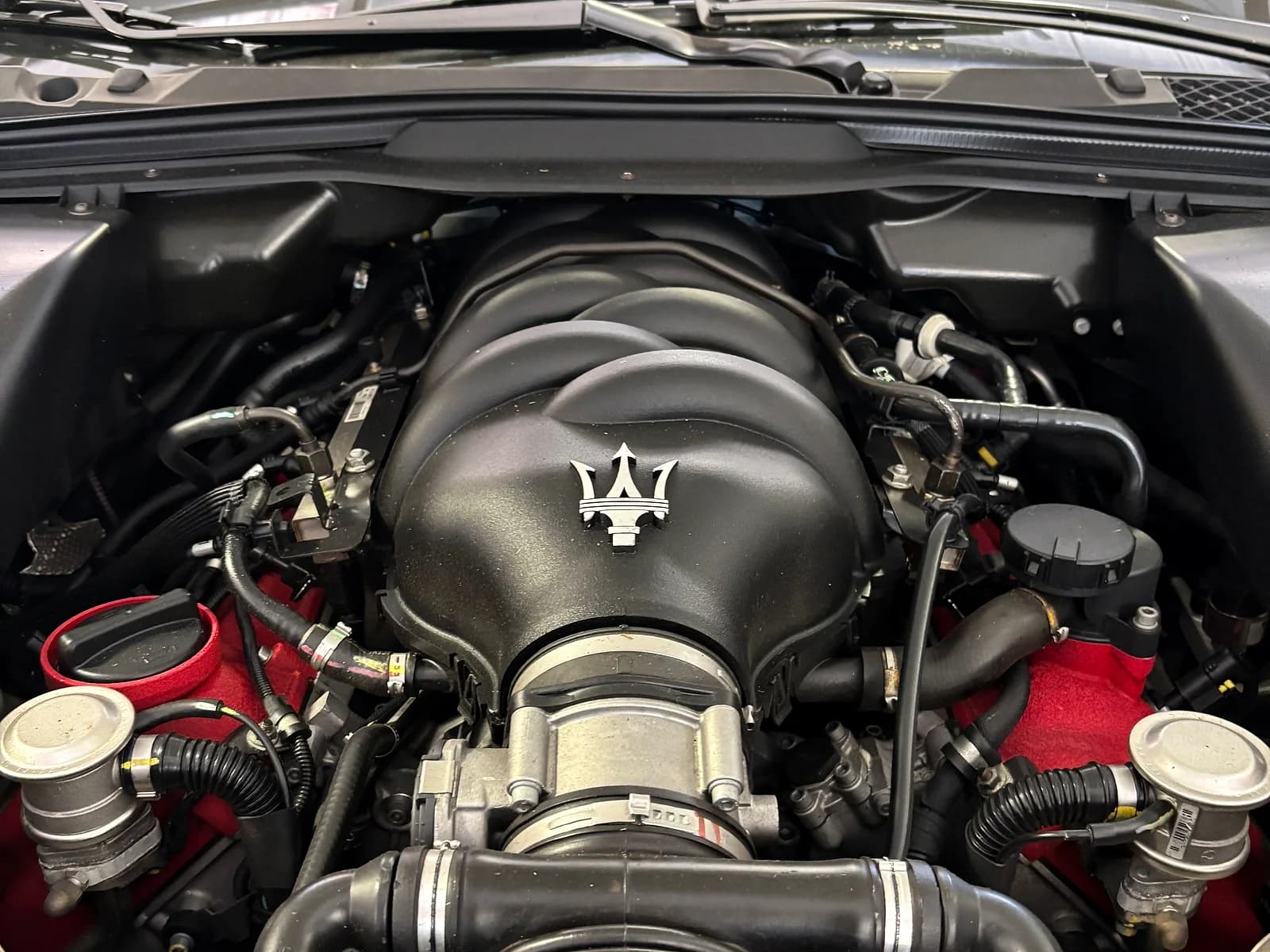 Maserati engine bay prepared for oil service